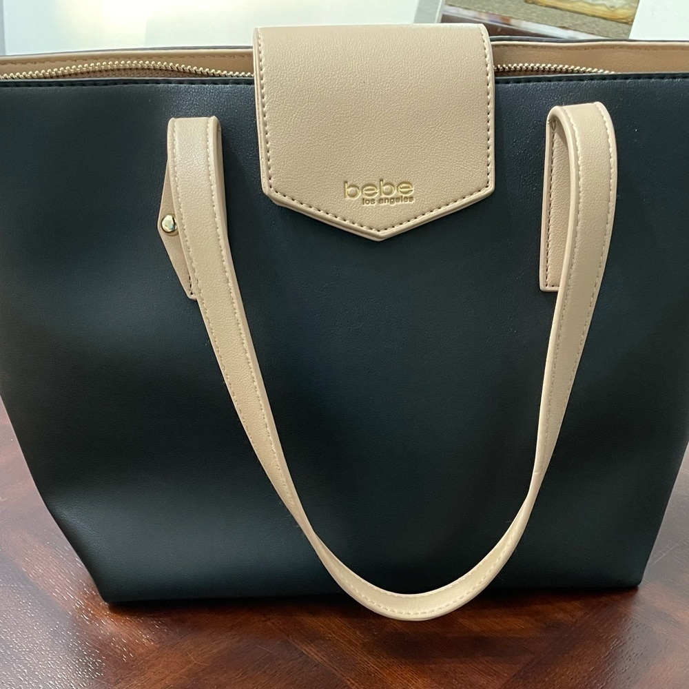 Bebe women’s two tone four smooth leather tote/ Handbag with top zipper.